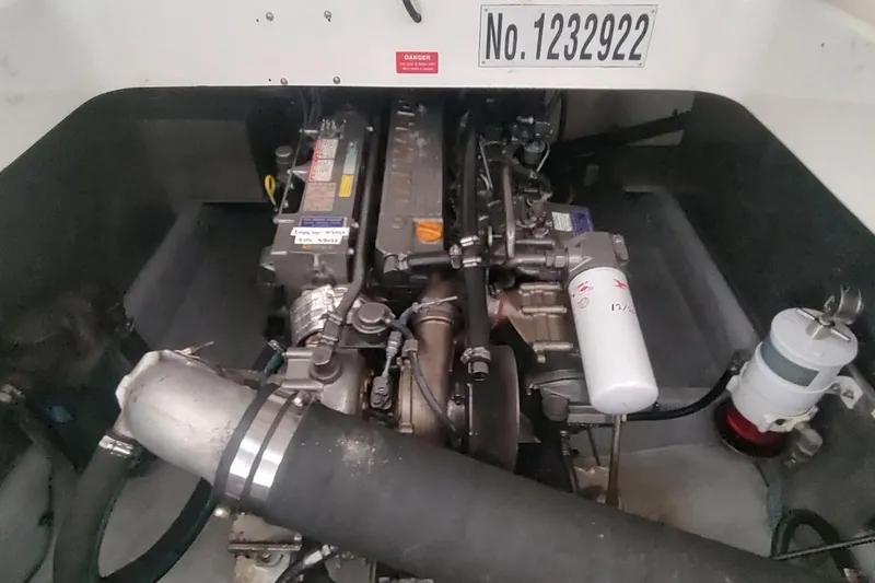 Slide: The Image of Engine compartment of 2003 Mainship 34 PILOT boat, showcasing mechanical components. - 68