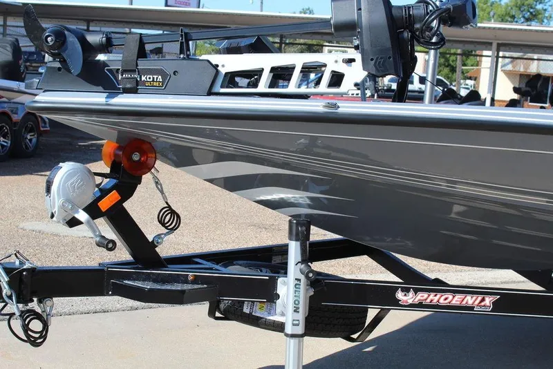 Slide: The Image of 2026 Phoenix 921 ELITE boat on trailer with Minn Kota Ultrex motor. - 13
