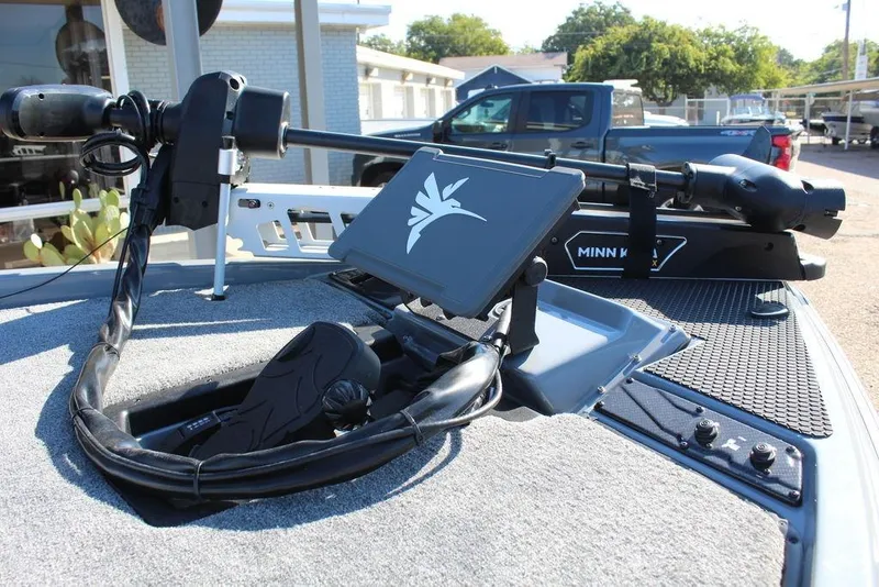 Slide: The Image of 2026 Phoenix 921 ELITE boat with Minn Kota trolling motor and control panel. - 18