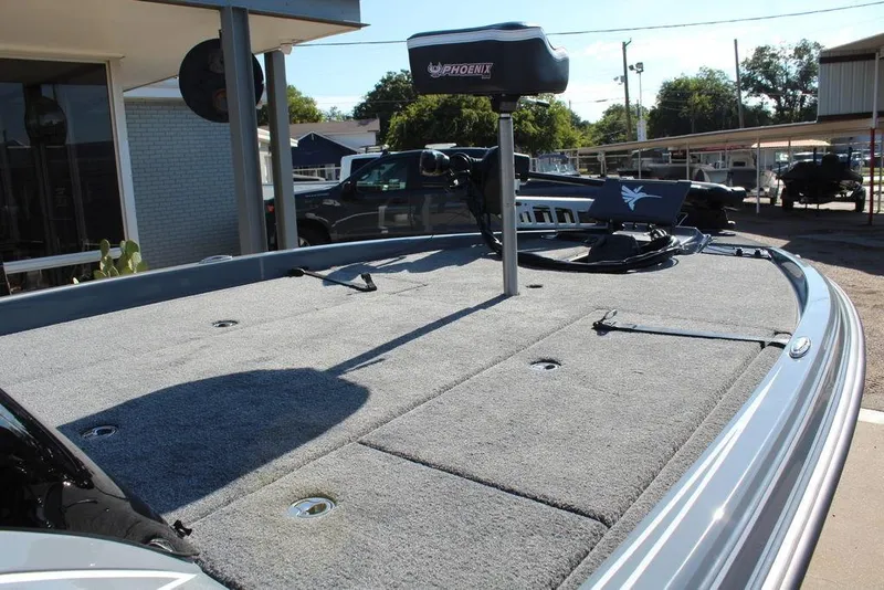 Slide: The Image of 2026 Phoenix 921 ELITE boat deck with carpeted surface and mounted equipment. - 19