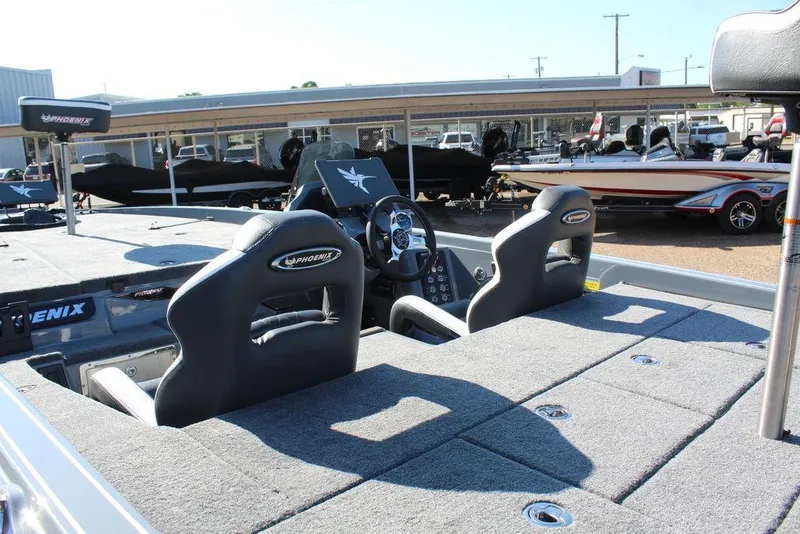Slide: The Image of 2026 Phoenix 921 ELITE boat interior with dual seats and steering console. - 7