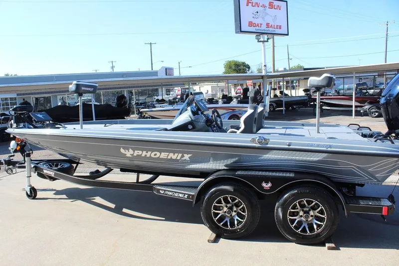 Slide: The Image of 2026 Phoenix 921 ELITE boat displayed at Fun-n-Sun Boat Sales dealership. - 9
