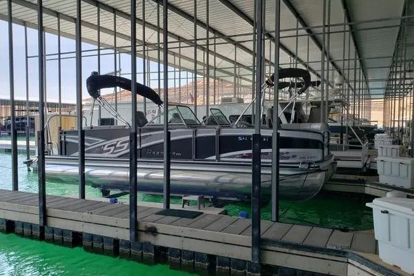 Slide: The Image of 2014 Premier Yachts 250 S-Series RF pontoon boat docked in a marina. - 16