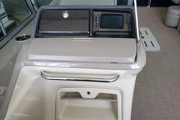 Slide: The Image of 2014 Premier Yachts 250 S-Series RF dashboard with control panel and storage compartment. - 3