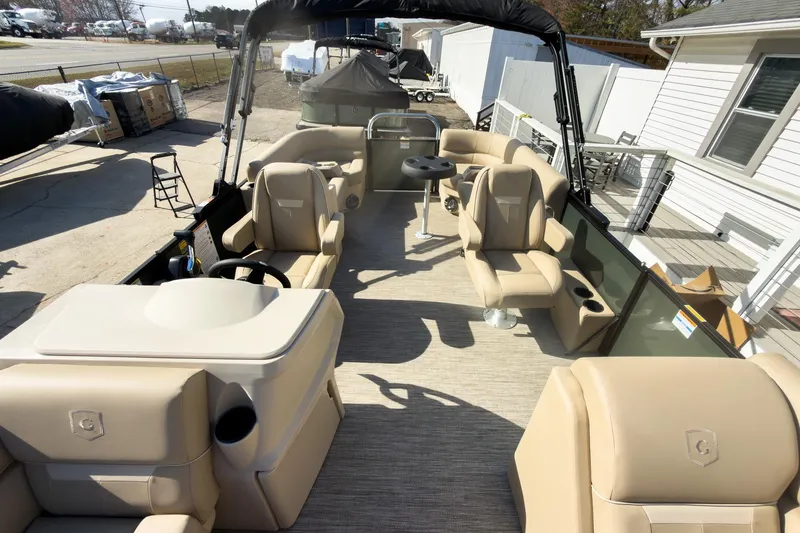 Slide: The Image of 2026 Godfrey Sweetwater Xperience 22' Split Bench Pontoon with beige seating and helm. - 13