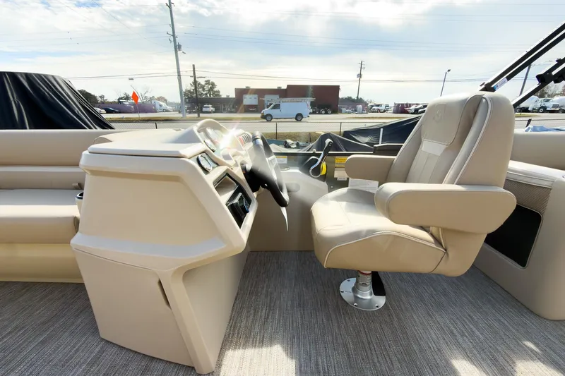 Slide: The Image of 2026 Godfrey Sweetwater Xperience 22' Split Bench Pontoon interior with captain's chair and helm. - 14