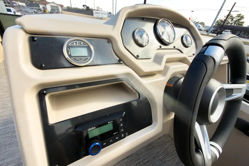 Slide: The Image of 2026 Godfrey Sweetwater Xperience 22' pontoon dashboard with steering wheel and controls. - 17
