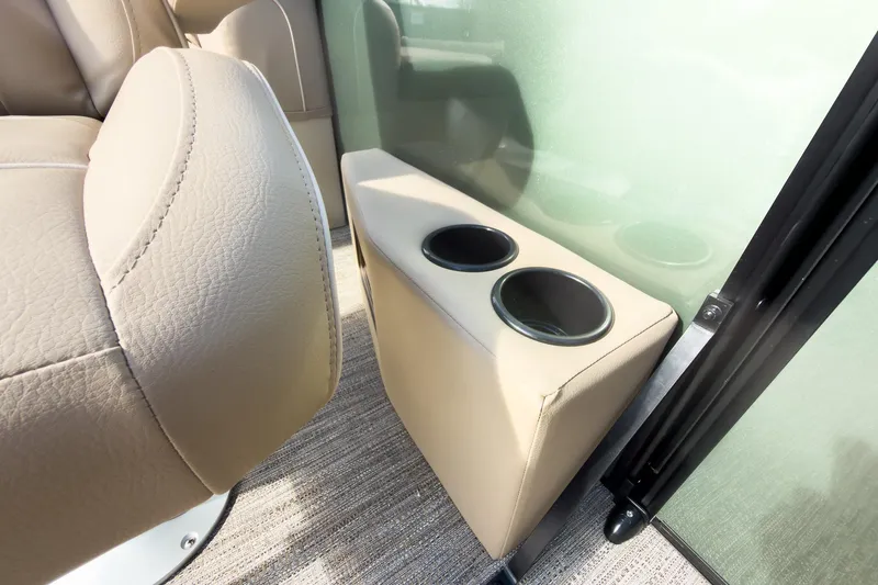 Slide: The Image of Beige interior of 2026 Godfrey Sweetwater Xperience pontoon with dual cup holders. - 19