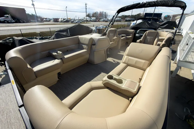 Slide: The Image of 2026 Godfrey Sweetwater Xperience 22' Split Bench Pontoon with beige seating and spacious layout. - 9