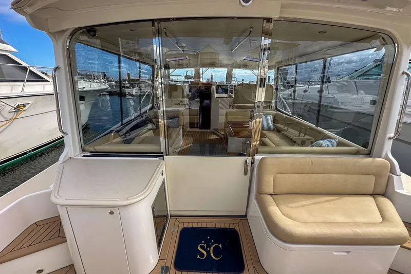 Slide: The Image of Luxurious 2017 MJM 50z yacht interior with plush seating and marina view. - 10