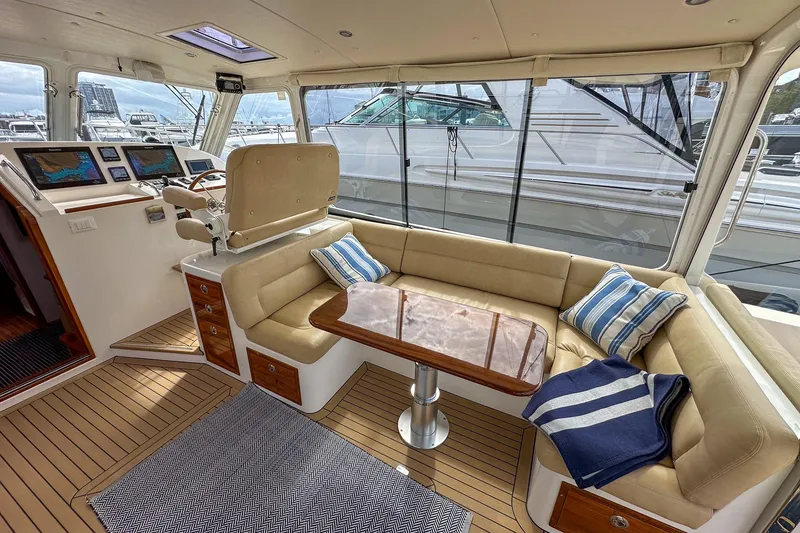 Slide: The Image of Luxurious interior of 2017 MJM 50z yacht with plush seating and navigation displays. - 12
