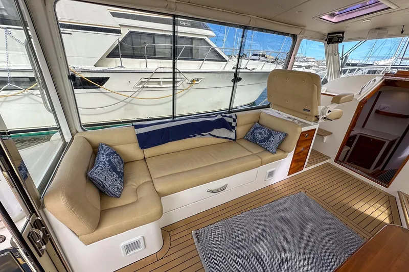 Slide: The Image of Luxurious interior of 2017 MJM 50z yacht with beige seating and nautical decor. - 13