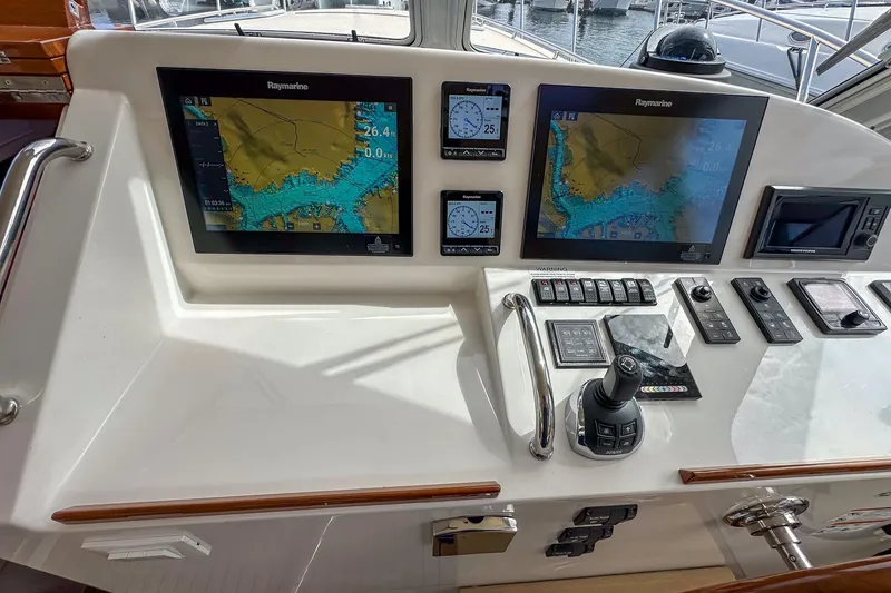 Slide: The Image of Helm of 2017 MJM 50z yacht with navigation screens and controls. - 18