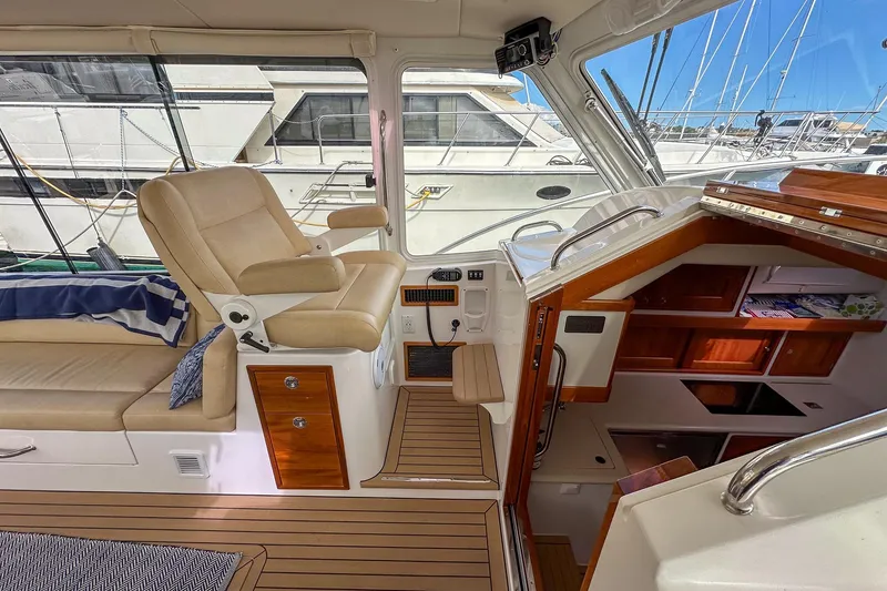 Slide: The Image of Interior of 2017 MJM 50z yacht with helm seat and cabin view. - 20