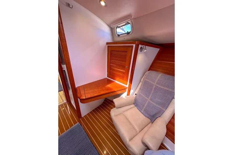 Slide: The Image of Luxurious interior of 2017 MJM 50z yacht with wooden accents and comfortable seating. - 26