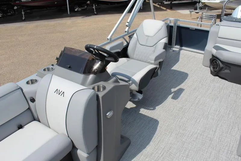 Slide: The Image of 2026 Avalon LSZ Cruiser Rear Bench 23 boat interior with modern seating and steering console. - 12