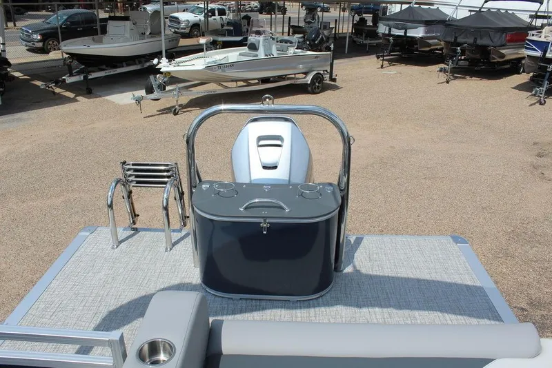 Slide: The Image of 2026 Avalon LSZ Cruiser Rear Bench 23 pontoon boat, featuring a sleek deck and ladder. - 16