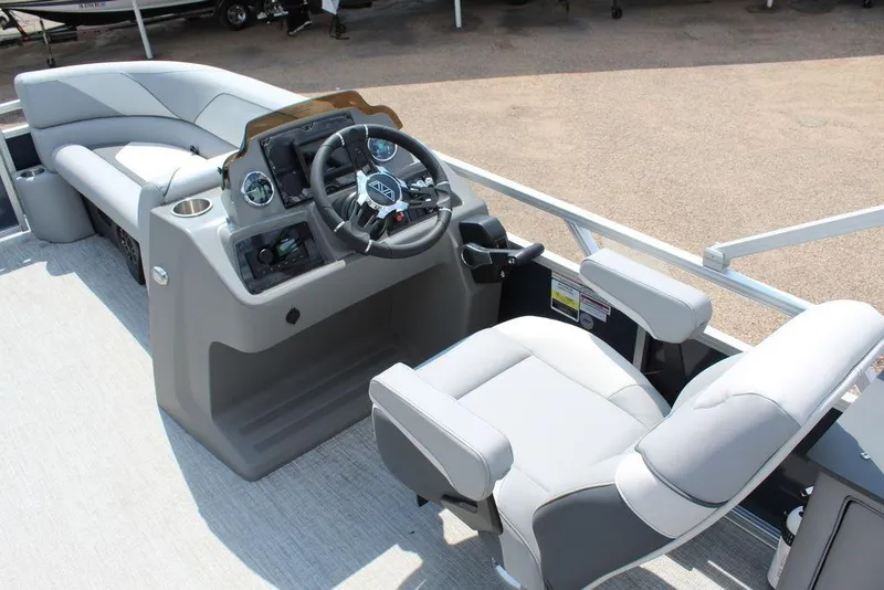 Slide: The Image of 2026 Avalon LSZ Cruiser Rear Bench 23 boat interior with steering console and seating. - 18