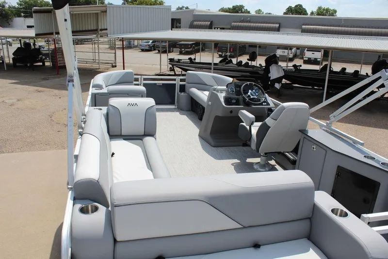 Slide: The Image of 2026 Avalon LSZ Cruiser Rear Bench 23 pontoon boat interior with modern seating and helm. - 22