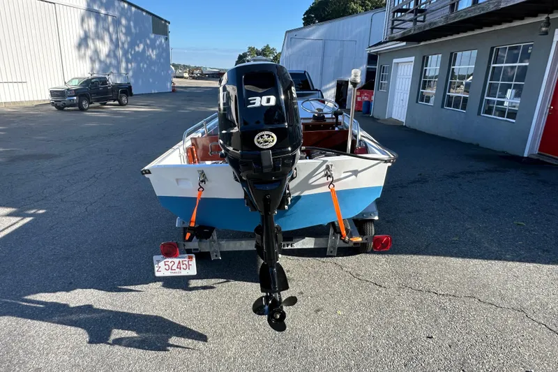 Slide: The Image of 1972 Boston Whaler 13 Super Sport boat on trailer with 30 HP motor. - 2