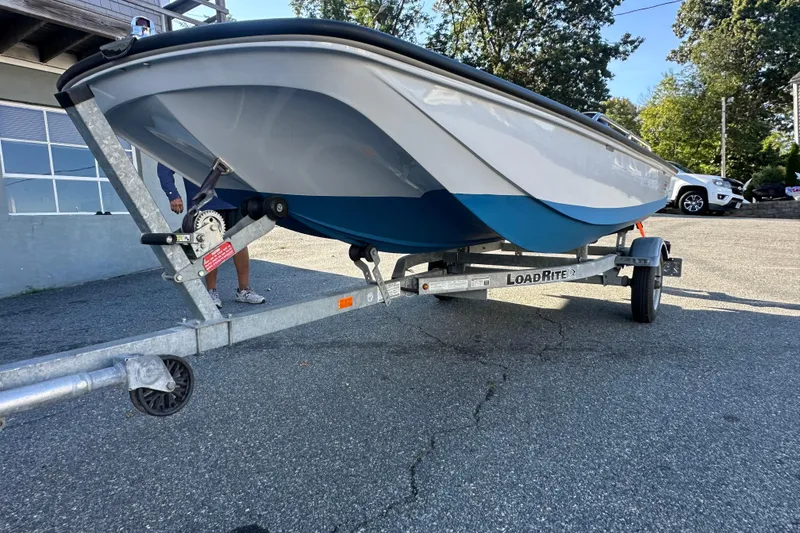 Slide: The Image of 1972 Boston Whaler 13 Super Sport on LoadRite trailer, parked outdoors. - 8