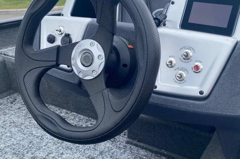 Slide: The Image of Steering wheel and controls of 2025 Tracker Pro Team 175 Crappie Edition boat. - 3