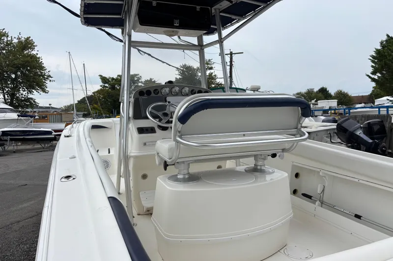 Slide: The Image of 1999 Wellcraft 302 Scarab Sport boat interior with steering console and seating. - 4