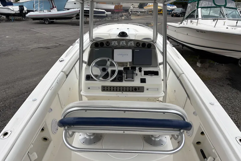 Slide: The Image of 1999 Wellcraft 302 Scarab Sport boat dashboard with steering wheel and controls. - 5