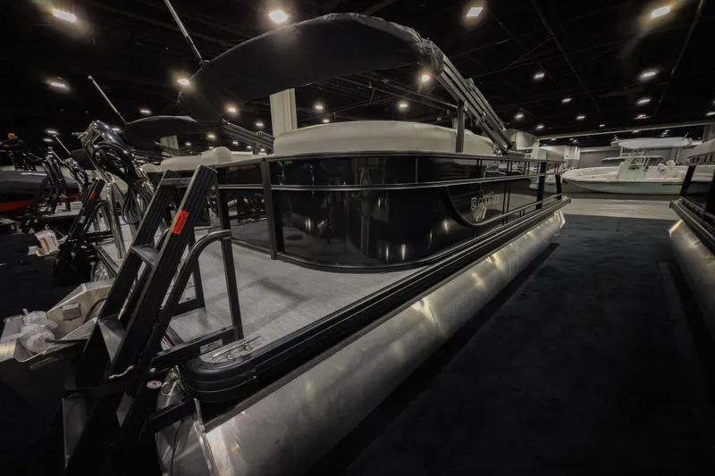 Slide: The Image of 2026 Godfrey Sweetwater Xperience 20' Split Bench Pontoon displayed indoors. - 25