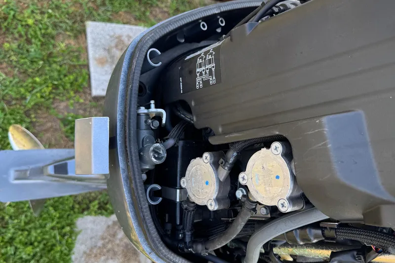 Slide: The Image of Close-up of a 2012 Carolina Skiff 238 DLV engine components. - 10