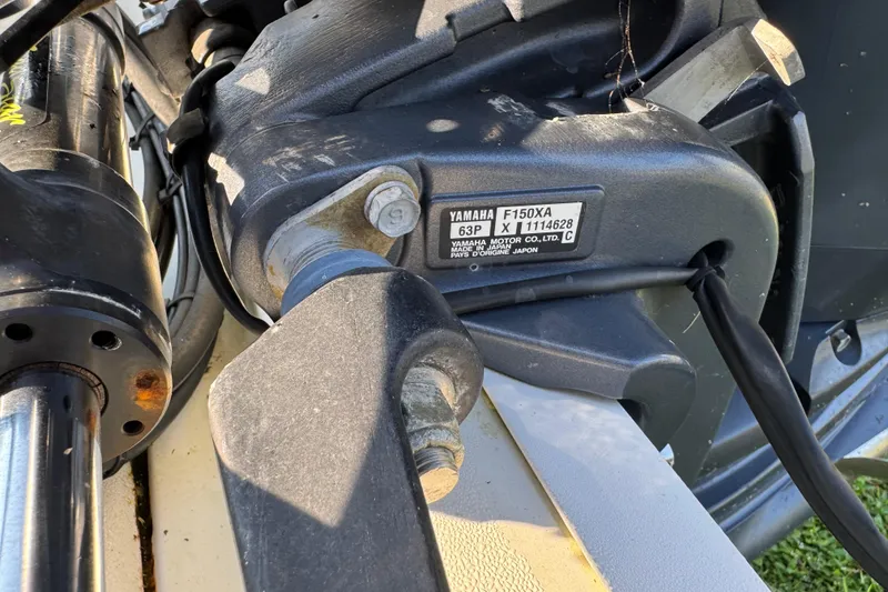 Slide: The Image of Close-up of a Yamaha F150XA motor on a 2012 Carolina Skiff 238 DLV boat. - 13