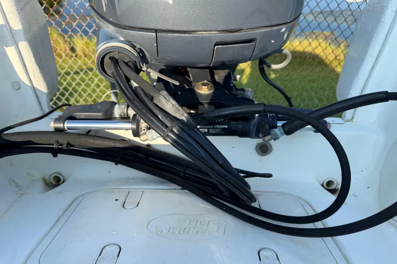 Slide: The Image of 2012 Carolina Skiff 238 DLV boat engine and hydraulic steering system close-up. - 15
