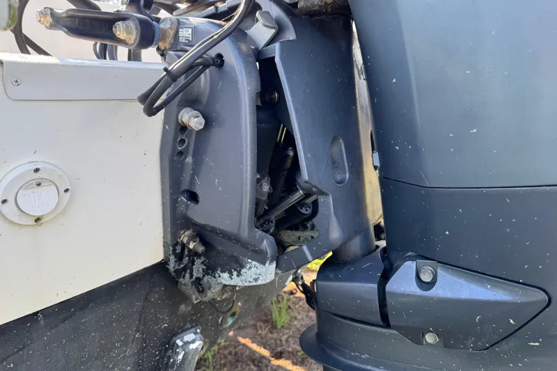 Slide: The Image of Close-up of a 2012 Carolina Skiff 238 DLV boat motor and mounting bracket. - 5