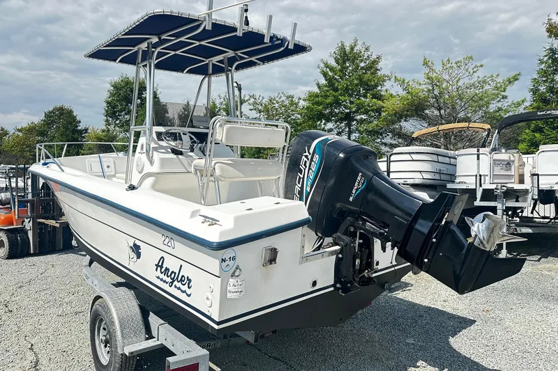 Slide: The Image of 1998 Angler 22 Center Console boat with Mercury outboard motor on trailer. - 2
