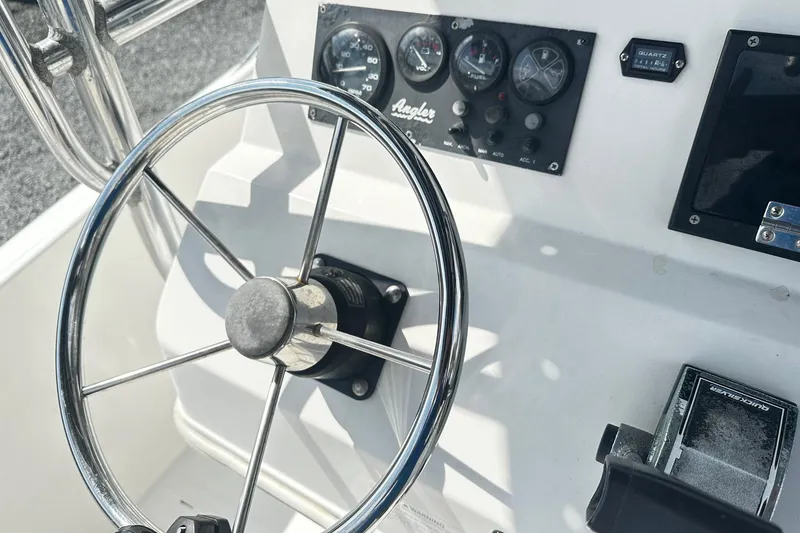 Slide: The Image of Steering wheel and dashboard of 1998 Angler 22 Center Console boat. - 5