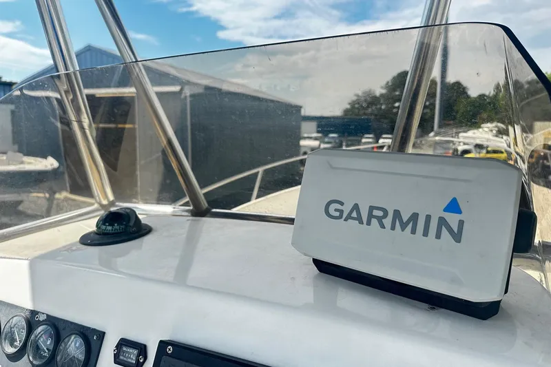 Slide: The Image of 1998 Angler 22 Center Console boat dashboard with Garmin navigation system. - 7