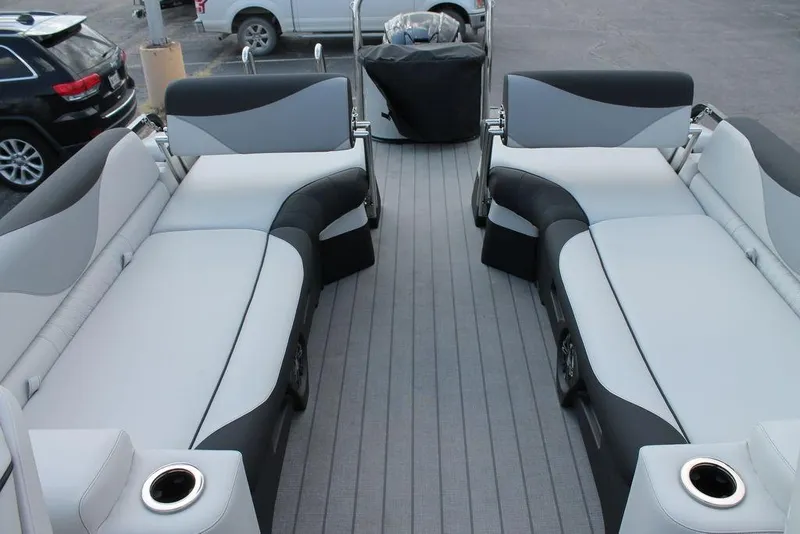 Slide: The Image of 2026 Avalon LSZ Quad Lounger Shift boat interior with sleek gray seating and cup holders. - 10