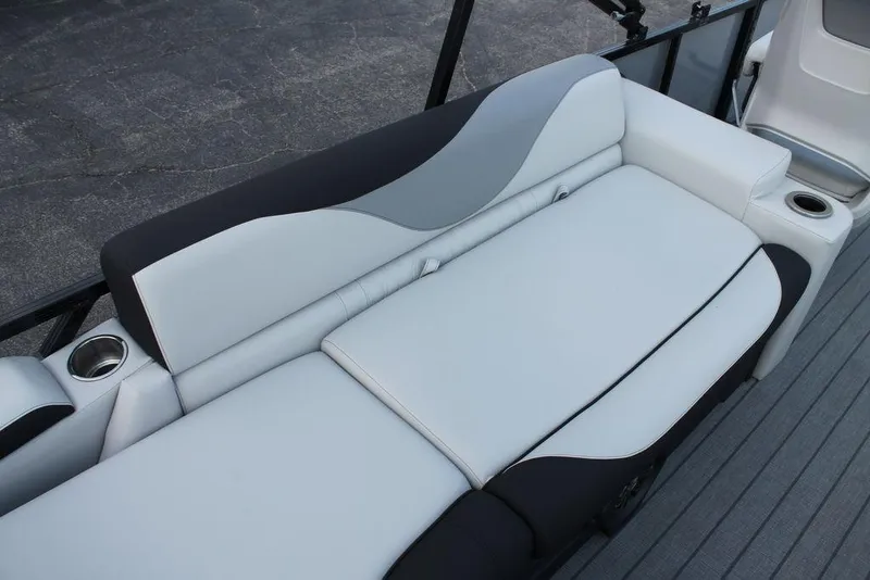 Slide: The Image of Luxurious seating on 2026 Avalon LSZ Quad Lounger Shift boat with cup holders. - 12