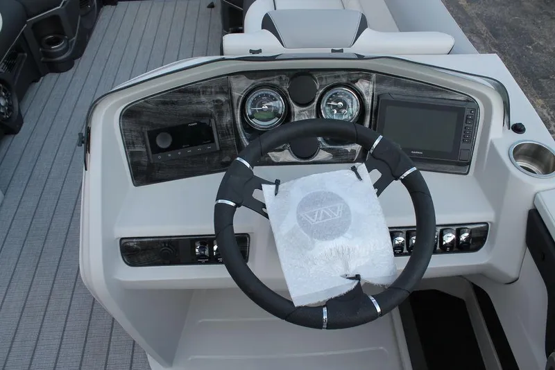 Slide: The Image of 2026 Avalon LSZ Quad Lounger Shift dashboard with steering wheel and control panel. - 13