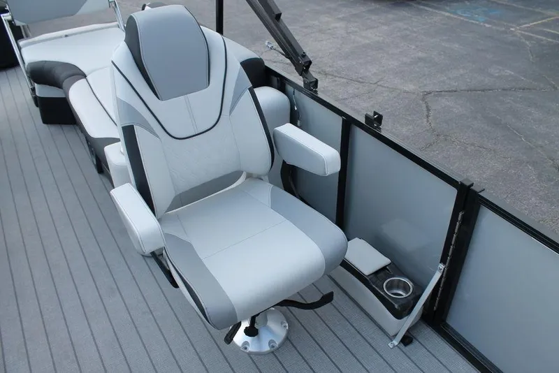 Slide: The Image of 2026 Avalon LSZ Quad Lounger Shift boat seat with modern design and cup holder. - 14