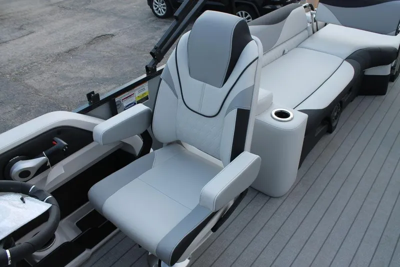 Slide: The Image of 2026 Avalon LSZ QUAD LOUNGER SHIFT boat interior with modern seating and steering wheel. - 15