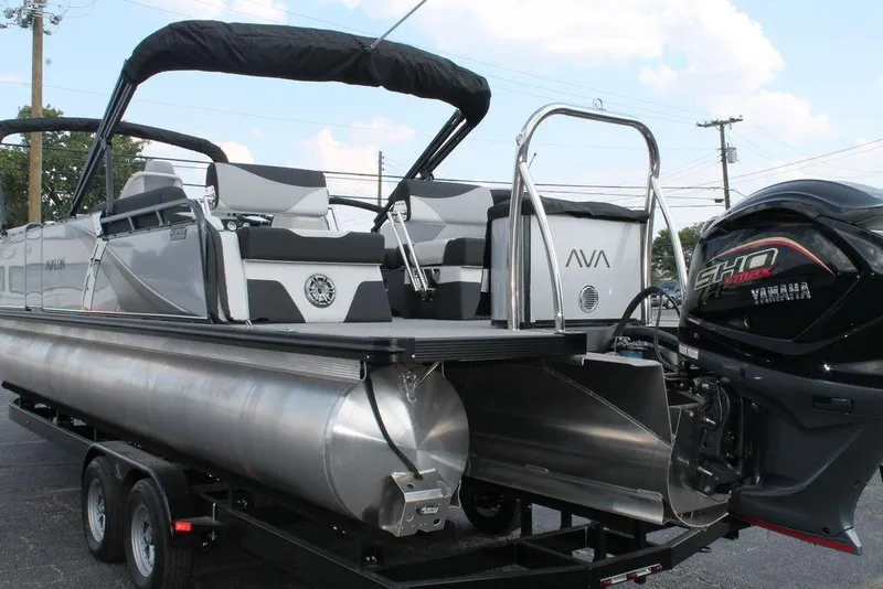 Slide: The Image of 2026 Avalon LSZ Quad Lounger Shift pontoon boat with Yamaha engine, rear view. - 17