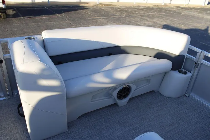 Slide: The Image of 2026 Avalon VLS QUAD LOUNGER 21 boat interior with plush seating and cup holders. - 13