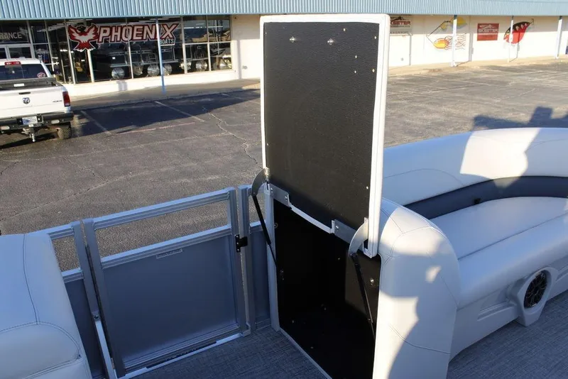 Slide: The Image of 2026 Avalon VLS QUAD LOUNGER 21 boat interior with seating and open gate. - 19