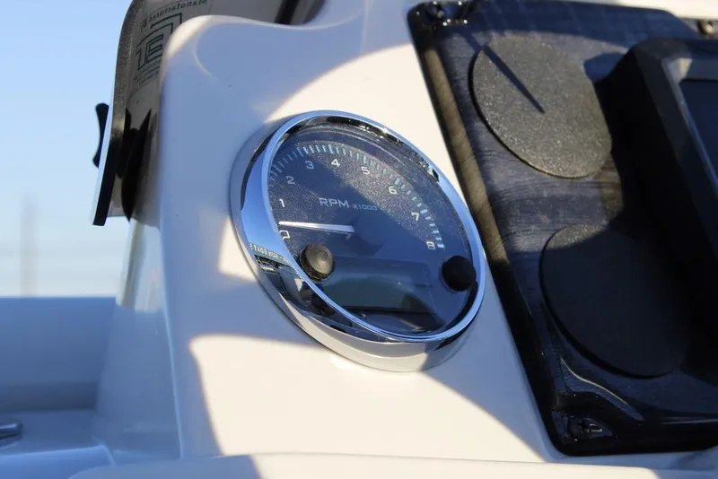 Slide: The Image of Close-up of RPM gauge on 2026 Avalon VLS QUAD LOUNGER 21 boat dashboard. - 25