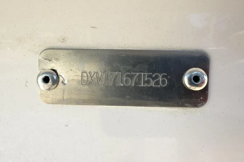 Slide: The Image of Metal identification plate on a 2026 Coastal Skiff 171 boat. - 12