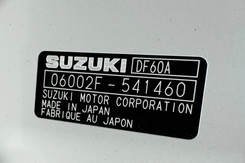 Slide: The Image of Suzuki DF60A engine label on 2026 Coastal Skiff 171, made in Japan. - 13