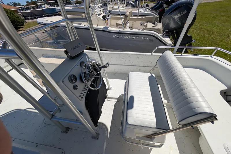 Slide: The Image of 2006 Carolina Skiff 2180 DLX boat interior with steering console and seating. - 8