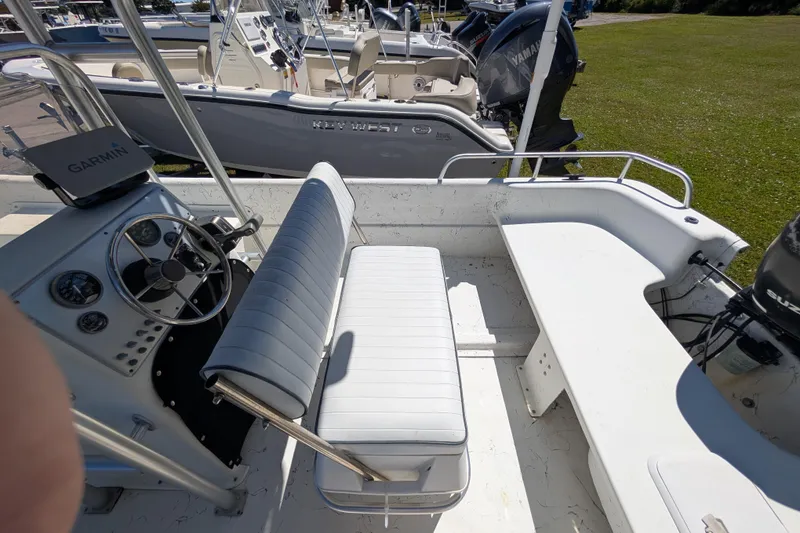 Slide: The Image of 2006 Carolina Skiff 2180 DLX boat interior with steering wheel and seating. - 9