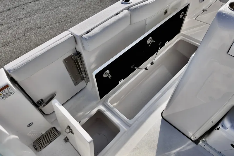 Slide: The Image of 2026 Sea Fox 328 Commander boat storage compartments and seating area. - 12